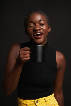 Ethnic woman with black mug