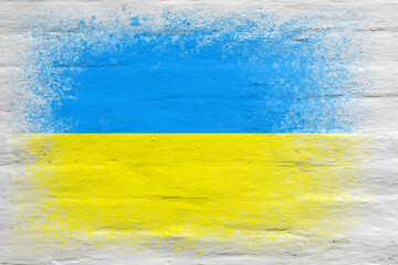 Flag of Ukraine. Flag painted on a white plastered brick wall. Brick background. Copy space. Textured background