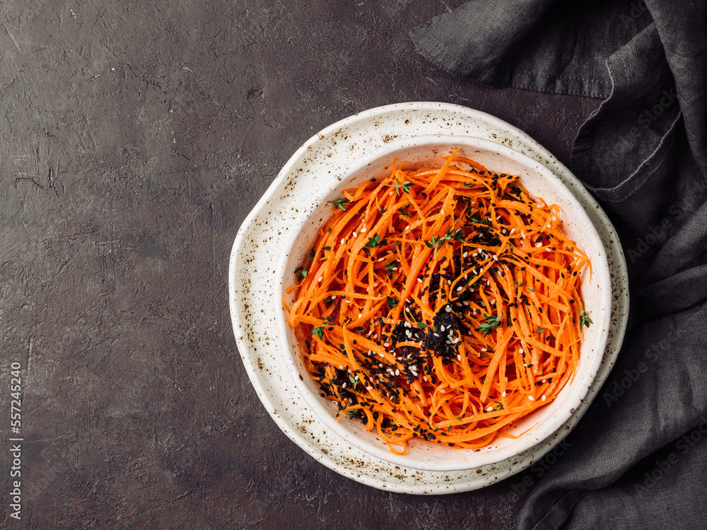 Wall mural Raw carrot noodles or spaghetti, top view