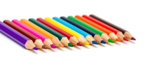 A set of colored pencils for children's creativity and drawing lies in a row,, isolated