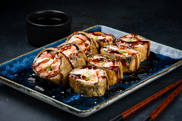 Fried sushi rolls with shrimp, cream cheese, avocado, sesame and teriyaki sauce.