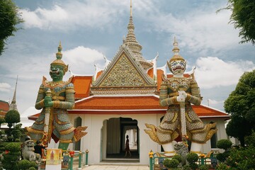 tourist girl at arun temple in bangkok, thailand