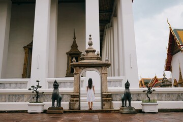 tourist girl at wat pho temple in bangkok, thailand