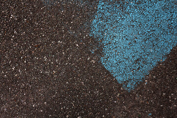 Blue paint on tarmac