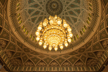 Fototapeta na wymiar The Largest Chandelier in the world hangs inside the Grand Mosque in Muscat