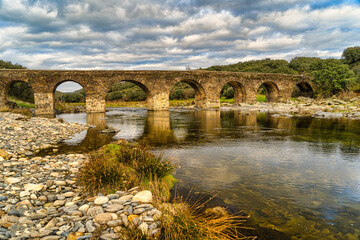 Fototapeta na wymiar Roman stone bridge over the river Alagon. Sotoserrano. Salamanca.