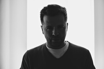 Silhouette portrait of young European man in profile isolated white background