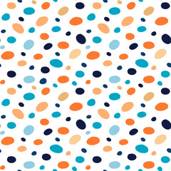 Vector pattern of oval multi-colored spots. Orange and blue shades. Seamless image.