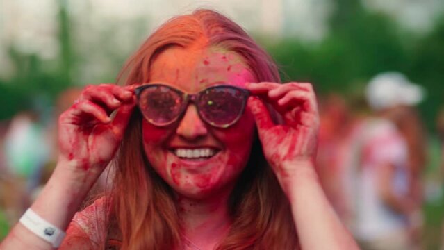  A beautiful young girl, all in bright colors at the Holi festival.