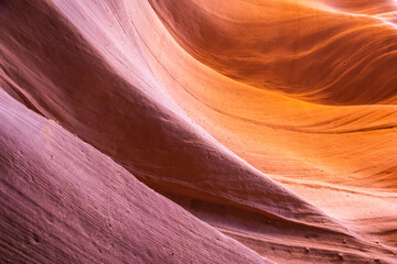 Details of the sandstone formations of Antelope canyon in Arizona with various hues of colors.