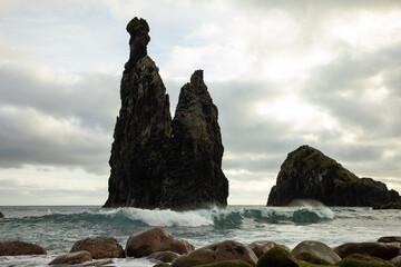 Big famous rock off the coast of Madeira in Portugal called Ribeira da Janela. great tourist attraction.