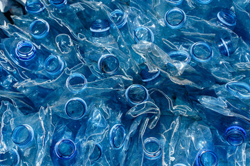 Used plastic bottle background. Recycle plastic trash and waste to protect the ecology and preserve the natural environment.