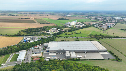 Supermarket warehouses drone aerial stock building construction shops, occupation annexation field arable quality land ground earth, a civilizational problem of a sustainable life new publix Europe