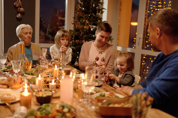 Cheerful family spending time together on Christmas horizontal portrait