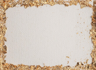 Gold (bronze) glitter empty frame beige gray paper canvas background. Abstract copy space texture.