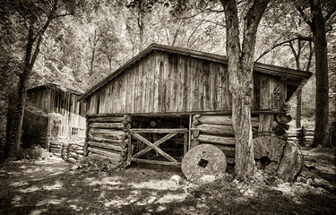 Old Grist Wheels In Front of Barn Near The Smokies