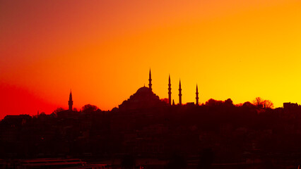 The historical S&uuml;leymaniye Mosque, built in the name of Suleiman the Magnificent in Istanbul, silhouette, sunset, space and writing area