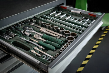 Equipment for auto mechanic. Metal cabinets with drawers. Tools for car repair at a service station
