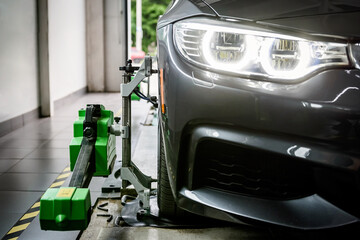 Balancing wheel in service center. Special professional equipment for wheel alignment