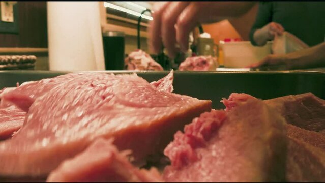 Cutting Ham Then Putting It In A Pan