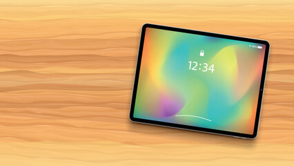 tablet with colorful wallpaper on wooden back