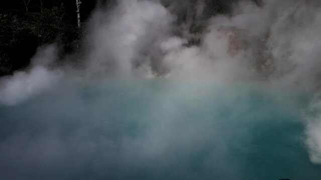 Oita, Japan - December 22, 2022: Clouds of steam rising from hot spring
