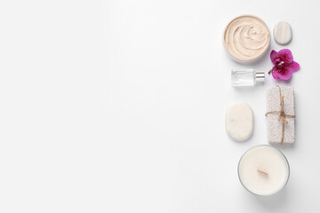 Flat lay composition with different spa products on white background. Space for text