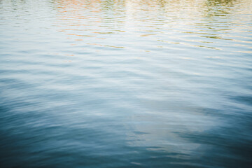 Shot of calm water surface of a river. Guadalquivir river in Seville, Spain.