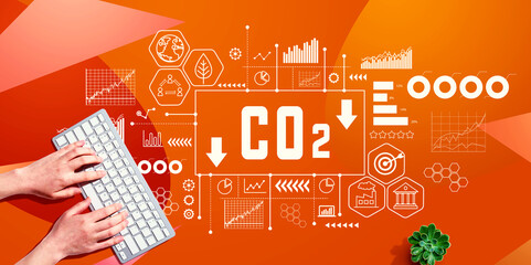 Reduce CO2 theme with person using a computer keyboard