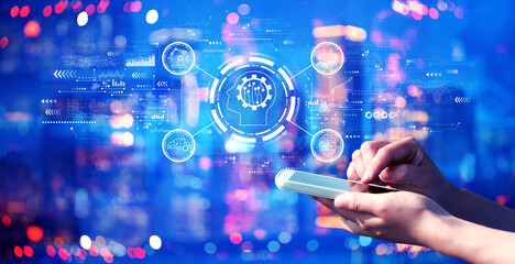 Future technology concept with person using a smartphone in a city at night