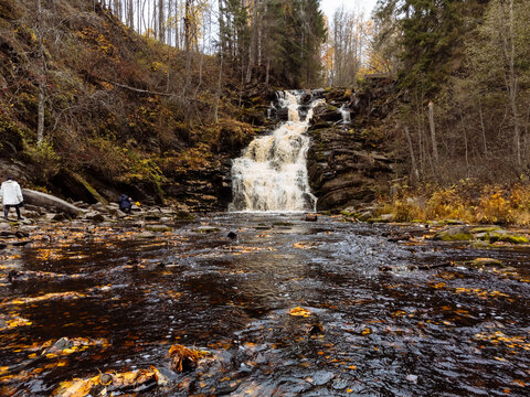 Long exposure shot of rapid on Ijjoki river on cloudy summer day. Waterfalls valley park, Karelia, Russia.