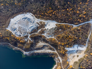 The autumn forest, lake, canyon, and quarry from above. The Ruskeala Park view from the drone