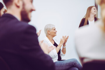 Successful business team clapping their hands for achieving goals,Business teamwork concept