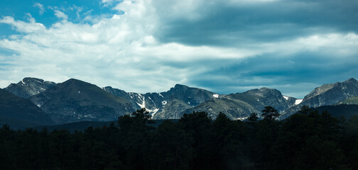 Snow Covered Rocky Mountains in the Distance