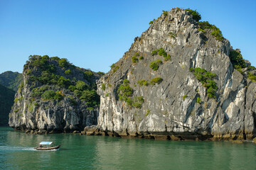 Cat Ba, Vietnam - December 21, 2022: A fishing boat in Lan Ha Bay in Cat Ba, Vietnam.