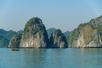 Cat Ba, Vietnam - December 21, 2022: A fishing boat in Lan Ha Bay in Cat Ba, Vietnam.