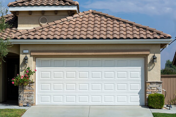 Steel automatic sectional garage door exterior view, single-family residence, Menifee, California, USA