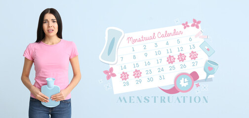 Young woman suffering from pain and menstrual calendar on light blue background
