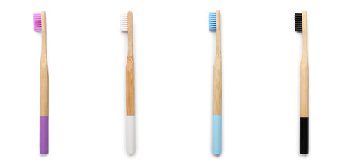 Set of bamboo toothbrushes isolated on white