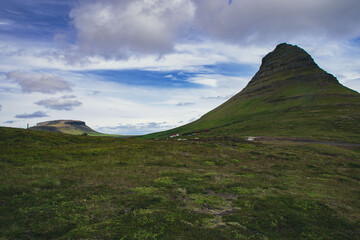 Beautiful nordic landscapes with mountains hills and waterfalls. Cloudy day