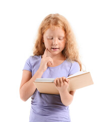 Little redhead girl reading old book on white background