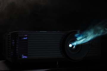 Modern video projector on black background