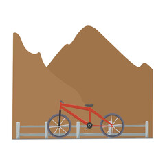 A bicycle standing in the middle of the road close to the mountain and the iron fence of the road