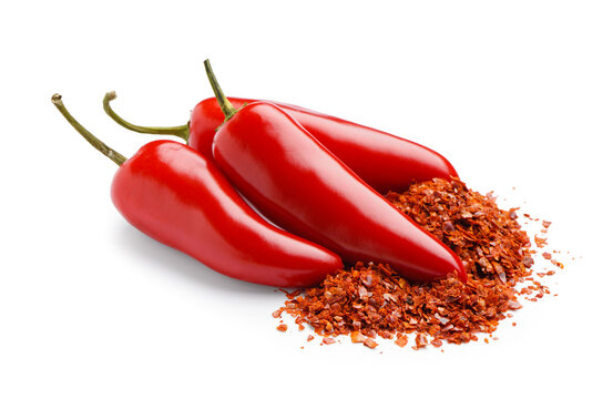 Fresh jalapeno peppers and chipotle chili flakes on white background