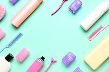 Frame made of hair care products and accessories on green background