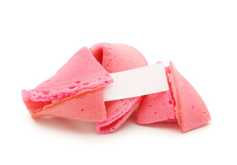 Pink fortune cookies with piece of paper on white background