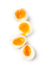Sliced soft boiled eggs on white background