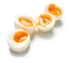 Sliced soft boiled eggs on white background