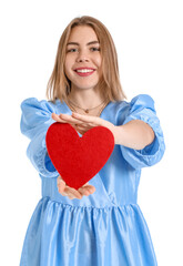 Young woman with paper heart on white background. Valentine's Day celebration