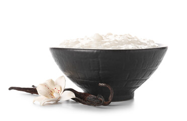 Bowl with delicious rice pudding and vanilla sticks on white background